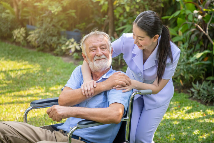 Caring Nurse Assists Elderly Man in Aged Care